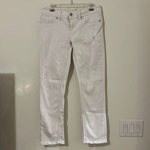 White slightly torn straight/ skinny jeans with silver stitching